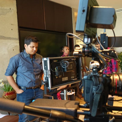 Bidhan Saha beside a cinema camera