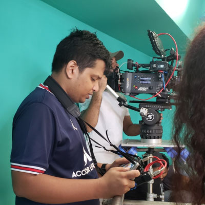 Bidhan Saha operating a camera