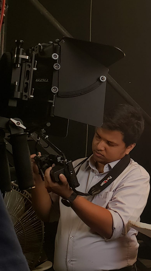 Bidhan Saha working with a cinema camera